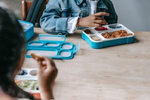 Fueling Young Minds: Happy kids enjoying a nutritious and delicious lunch together."